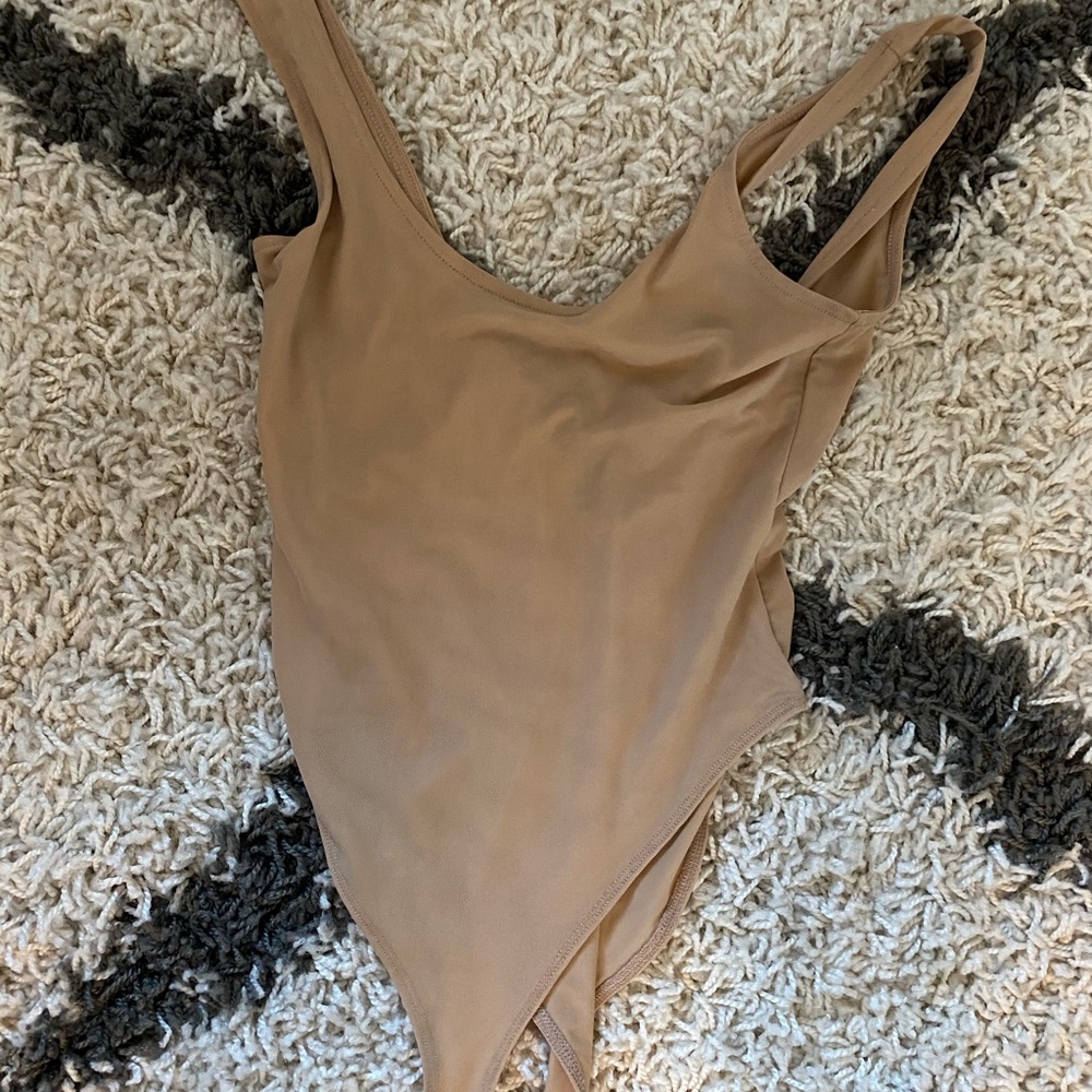 Brand new Nude bodysuit. Thong as butt area